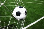 Soccer Ball In Goal Stock Photo