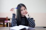 Portrait Of Thai Teen Beautiful Girl Writing Book Stock Photo