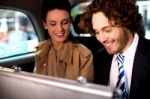 Business Colleagues Travelling Together In Taxi Cab Stock Photo