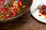 Fried Chili Pepper And Vegetable On A Wok Pan Stock Photo