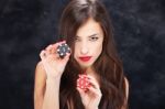 Woman Holding Chips For Gambling Stock Photo