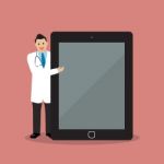 Doctor Pointing To The Screen Of A Tablet Stock Photo