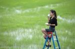 Girl Drinking Coffee On Stair Stock Photo