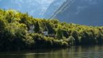 Castle Schloss On The Shoreline Of Lake Hallstatt Stock Photo