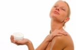 Woman Applying Moisturiser Stock Photo