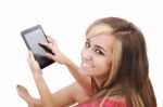 Young Women Sitting With Tablet PC Stock Photo