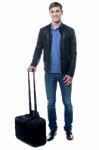 Young Man All Set To Fly For His Vacations Stock Photo