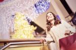 Beautiful Young Woman Holding Shopping Bags Stock Photo