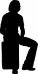 Silhouette Man Sitting On Suitcase Stock Photo