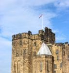 Flag Flying Over Castle Stock Photo