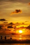 Dramatic Sea And Transport Boat In Color Of Sunset Stock Photo