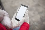 Mobile Phone In Hands With Glowes, Cold Weather Stock Photo