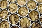 Many Coin Lined In Silver Bowl Stock Photo