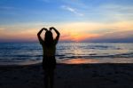 Asian Girl With Heart Shape On The Sunset Beach Stock Photo