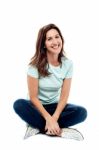 Relaxing Woman Sitting On Floor Stock Photo