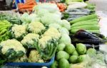 Assorted Fruit And Vegetable Trays In The Market Stock Photo