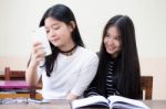 Two Asia Thai High School Student Uniform Best Friends Beautiful Girl Reading Book Stock Photo