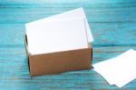 Business Cards In Paper Box On Wood Desk Stock Photo