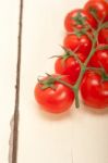 Fresh Cherry Tomatoes On A Cluster Stock Photo