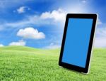 Tablet Pc On Green Grass Stock Photo