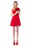 Tall Sexy Girl Holding Heart Shaped Gift Stock Photo