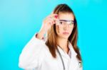 Woman Looking At The Chemical Tube Stock Photo