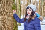 Portrait Of Young Beautiful Woman Walking In The Woods Stock Photo