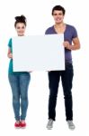 Teenage Couples Holding Blank Board Stock Photo