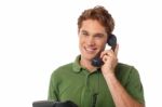 Young  Man Holding A Receiver And Talking Stock Photo