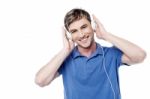 Cheerful Young Man Enjoying  Music Stock Photo