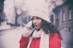 Beautiful Girl In Red Coat And Wool Cap And Gloves With Smartpho Stock Photo