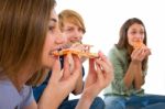 Teenagers Eating Pizza Stock Photo