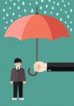 Hand Holding An Umbrella Protecting Businessman Stock Photo