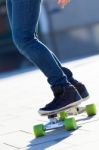 Legs Of Young Boy Skating Down The Street Stock Photo