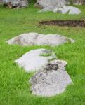 Rock On Grass Field From Public Park Stock Photo