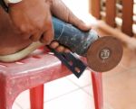 Mechanic Sawing Metal Stock Photo