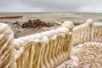 Ice Covered Staircase On The Beach Stock Photo