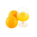 Orange Juice In Brandy Glass And Two Fruit On White Background Stock Photo