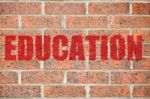 Old Brick Wall Texture With Education Inscription Stock Photo