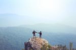 Instagram Filter Young Man Asia Tourist At Mountain Is Watching Over The Misty And Foggy Morning Sunrise, Travel Trekking Stock Photo