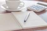 Blank Notebook With Pen On Wooden Table Stock Photo