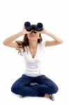 Sitting Female Looking Through Binocular Stock Photo