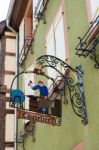 Hanging Sign In Riquewihr In Haut-rhin Alsace France Stock Photo