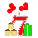 Number Seven Candle Shows Cupcakes Balloons And Presents Stock Photo