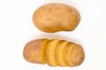 Sliced Potato And Whole Isolated On A White Background Stock Photo