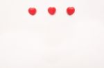 Three Red Valentine's Day Heart Shape Candy Line On White Paper Background. Love Concept. Minimalism Style. Knolling Top View Stock Photo