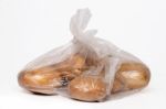 View Of Some Bananas Inside A Plastic Bag Stock Photo