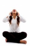 Young Woman Listening To Music And Singing Stock Photo