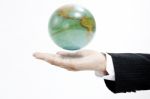 Businessman Holding Globe Stock Photo