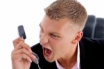 Angry Employee Shouting On Phone Stock Photo